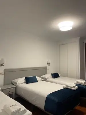 Cama o camas de una habitación en Villa María Hotel