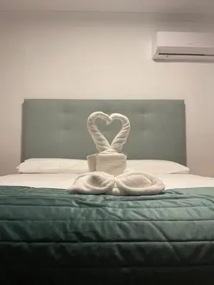 Cama o camas de una habitación en Villa María Hotel