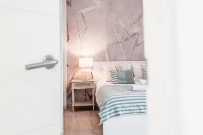 Cama o camas de una habitación en Elegante y acogedor apartamento centro Sevilla Hiniesta 1 habitación