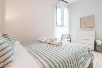 Cama o camas de una habitación en Elegante y acogedor apartamento centro Sevilla Hiniesta 1 habitación