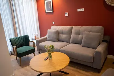 Zona de estar de Arena Centro Rooms&Suites, by Homing U
