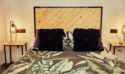 Cama o camas de una habitación en Casas Rurales El Tajo
