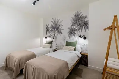 Cama o camas de una habitación en Apartamentos Cano y Cueto , Jardines de Murillo