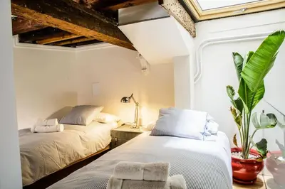 Cama o camas de una habitación en Posada Alameda de Hércules