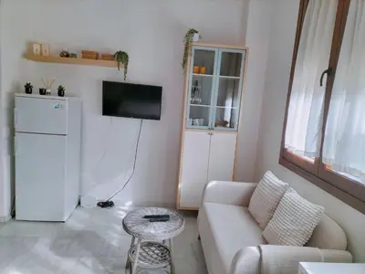 Una televisión o centro de entretenimiento en Apartamento de Lux Sevilla Este
