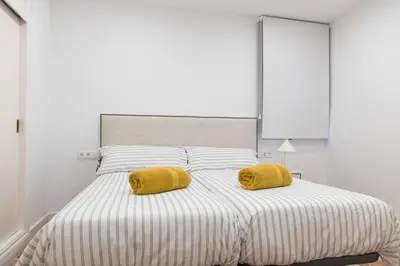 Cama o camas de una habitación en La Bodega Con Parking Gratis