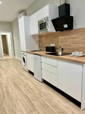Una cocina o zona de cocina en Jardines Suites GP