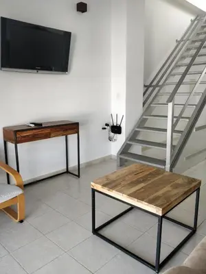 Una televisión o centro de entretenimiento en Apartamento Los Cascabeles