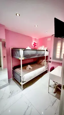Cama o camas de una habitación en CENTRO, PARKING, PISCINA 2 Dormitorios SUITE PONDOS