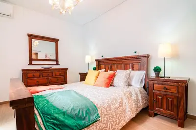 Cama o camas de una habitación en Edomus El Patio de la Macarena