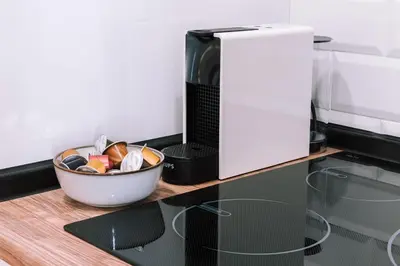 Una cocina o zona de cocina en Optimum Sevilla Loft Boutique