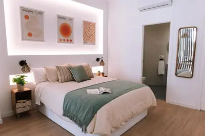 Cama o camas de una habitación en Optimum Sevilla Loft Boutique