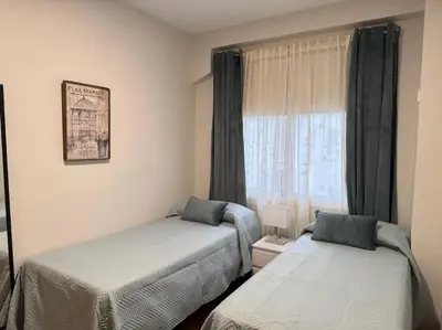 Cama o camas de una habitación en apartamento lux nervión