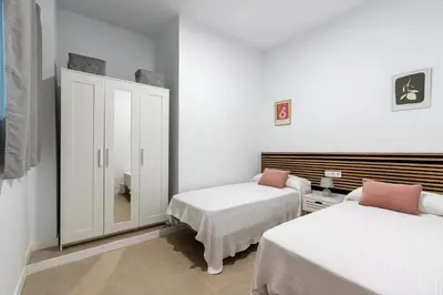 Cama o camas de una habitación en La Flor de Sevilla
