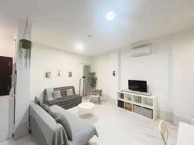 Una televisión o centro de entretenimiento en Center Sevilla Confort 5