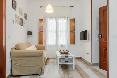 Una televisión o centro de entretenimiento en Moderno y Céntrico Apartamento