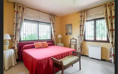 Cama o camas de una habitación en Casa de campo con piscina junto a Sevilla
