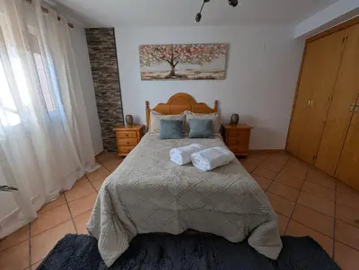 Cama o camas de una habitación en Casa Rural el Olivar Chumi