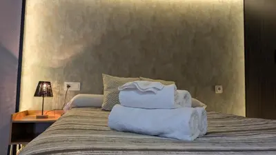 Cama o camas de una habitación en Habitaciones El Lagarto a gusto
