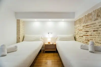 Cama o camas de una habitación en Amplio apartamento de diseño precioso con parking incluido en pleno centro