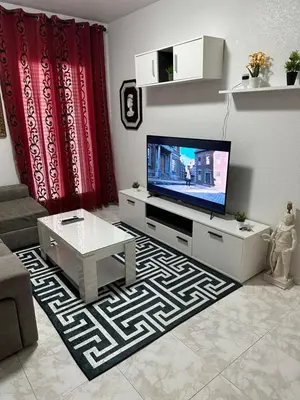 Una televisión o centro de entretenimiento en Apartament Luxor