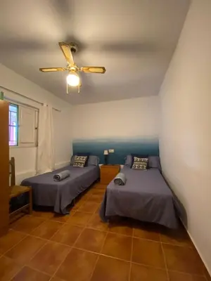 Cama o camas de una habitación en La Casa del Abuelo Jose