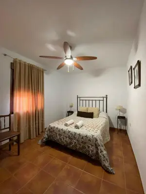 Cama o camas de una habitación en La Casa del Abuelo Jose
