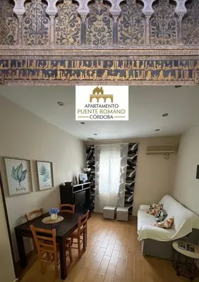 Cama o camas de una habitación en Vivienda Puente Romano