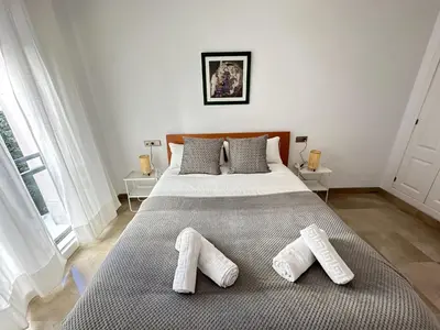 Cama o camas de una habitación en Buhaira Suite Sevilla