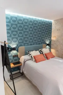 Cama o camas de una habitación en Mirador del Pósito - Apartamento luminoso en el centro de Jaén
