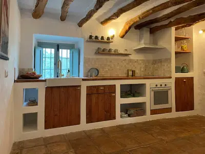 Una cocina o zona de cocina en Cortijo La Pedriza