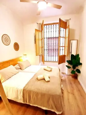 Cama o camas de una habitación en El jardín de Antequera