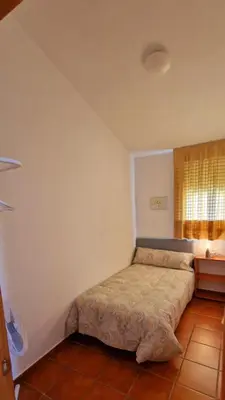 Cama o camas de una habitación en Casa en El Pedroso de tres habitaciones