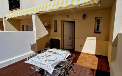 Zona de estar de Casa en El Pedroso de tres habitaciones