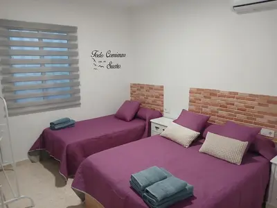 Cama o camas de una habitación en Apartamentos de la mansión