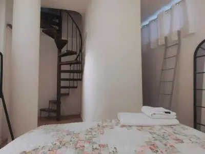 Cama o camas de una habitación en El Alma de Sevilla