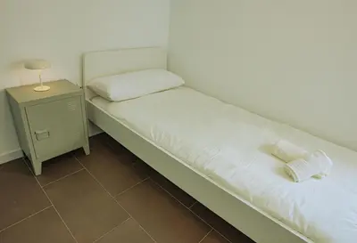 Cama o camas de una habitación en Apartamentos Turísticos Pilaria