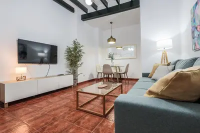 Una televisión o centro de entretenimiento en M. Auxiliadora Tranquilo y acogedor