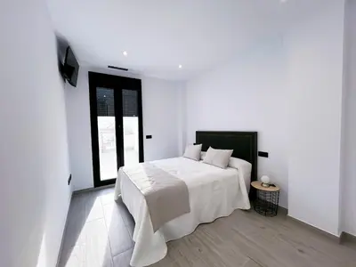 Cama o camas de una habitación en Adagio - Apartamentos La Clave