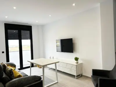 Una televisión o centro de entretenimiento en Allegro - Apartamentos La Clave