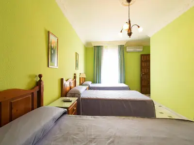 Cama o camas de una habitación en Hostal San Francisco