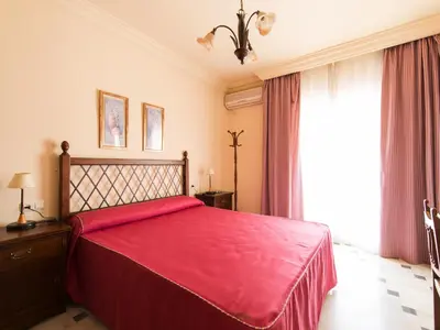 Cama o camas de una habitación en Hostal San Francisco