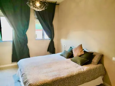 Cama o camas de una habitación en Happy Sevilla