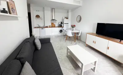 Una televisión o centro de entretenimiento en Apartamento acogedor - piscina - parking