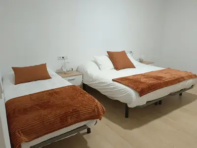 Cama o camas de una habitación en Apartamentos La Fuente