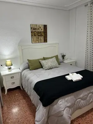 Cama o camas de una habitación en Apartamento espacioso El Olivo