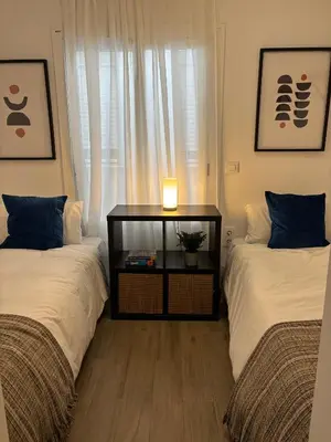 Cama o camas de una habitación en Alohamundi Santa Clara