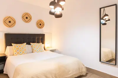 Cama o camas de una habitación en Alohamundi Santa Clara