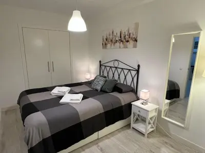 Cama o camas de una habitación en El refugio de San Miguel & parking gratuito