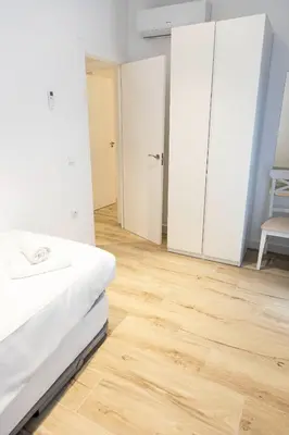 Cama o camas de una habitación en Alojamientos Carola Julio Burell, 74